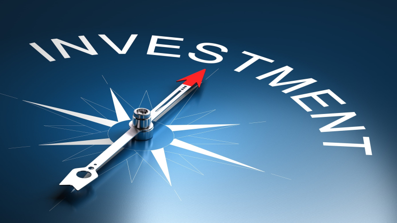 Needle of a compass pointing to the word investment 3D Render suitable for financial risk management concept.
